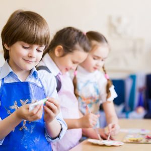 Little children painting and playing at kindergarten  Kviečiame skirti 1,2 % pajamų mokesčio paramą children drawing and painting P56BV2V 300x300